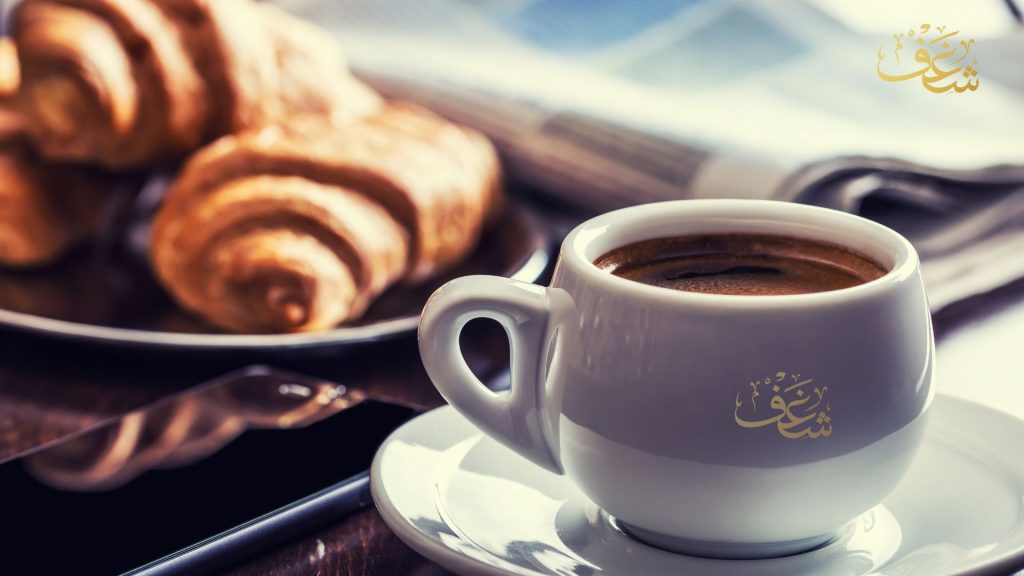 Mocha coffee with whipped cream and chocolate drizzle at Shaghf VA Café